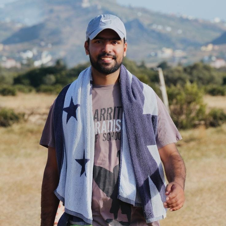 Kaveri Mehta, Lead Design Curator at PebbleStreamOak, reviewing corporate floral arrangements